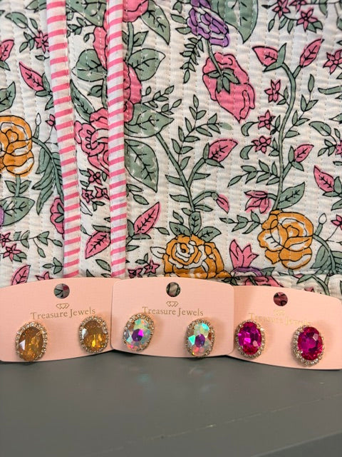 The glow studs in gold, fuchsia, and sugar