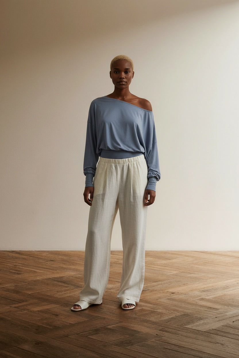 Full body view of the model wearing Soft Knit Off Shoulder Slouchy Top