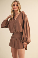IR2396 LINEN LONGSLEEVE BUTTON AND SMOCKED WAIST ROMPER: Black / S