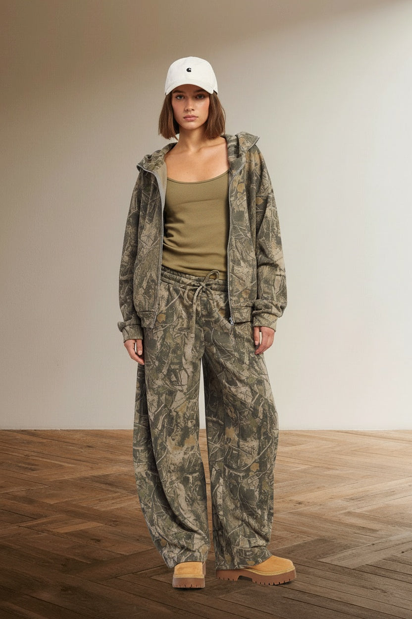 Full body view of the model wearing Camo Print Barrel Pants