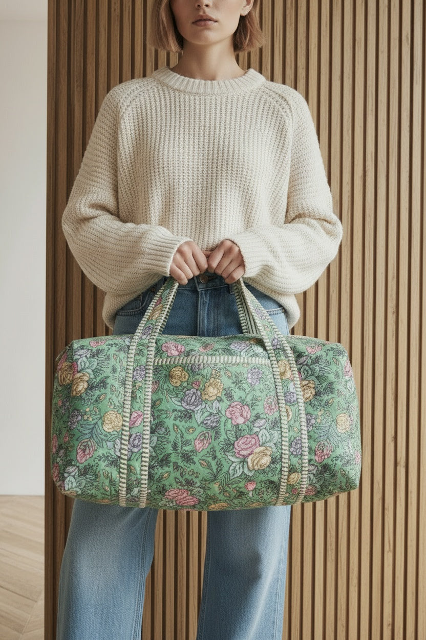 Close-up of the model wearing Handmade Quilted Cotton Duffle Bag, Block Printed Floral Weekender