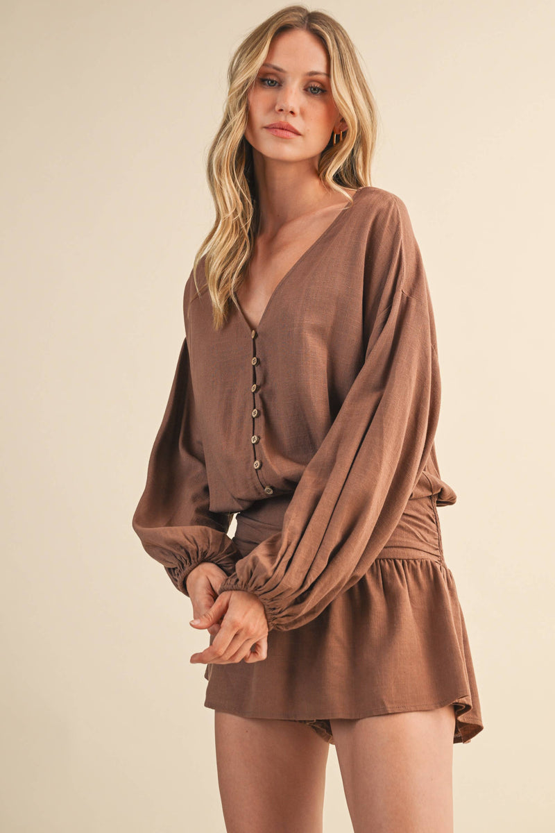 IR2396 LINEN LONGSLEEVE BUTTON AND SMOCKED WAIST ROMPER: Black / S