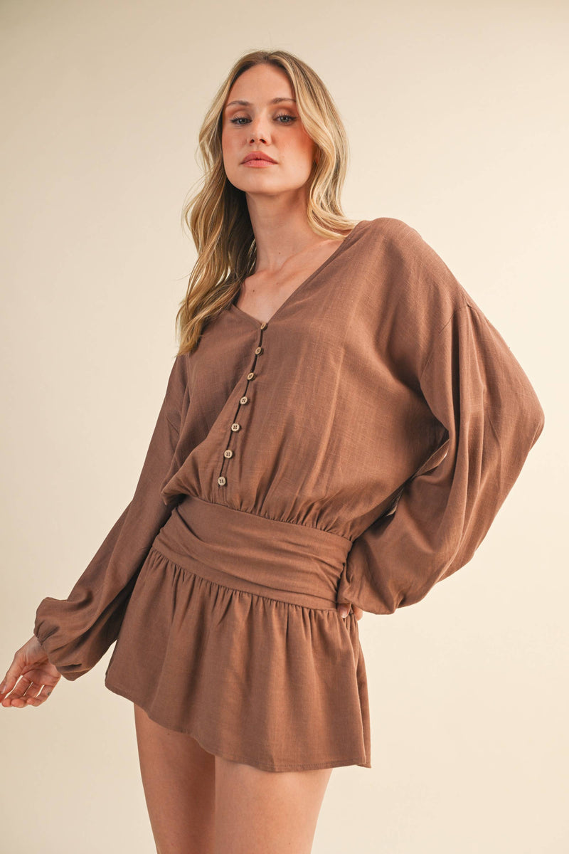 IR2396 LINEN LONGSLEEVE BUTTON AND SMOCKED WAIST ROMPER: Black / S